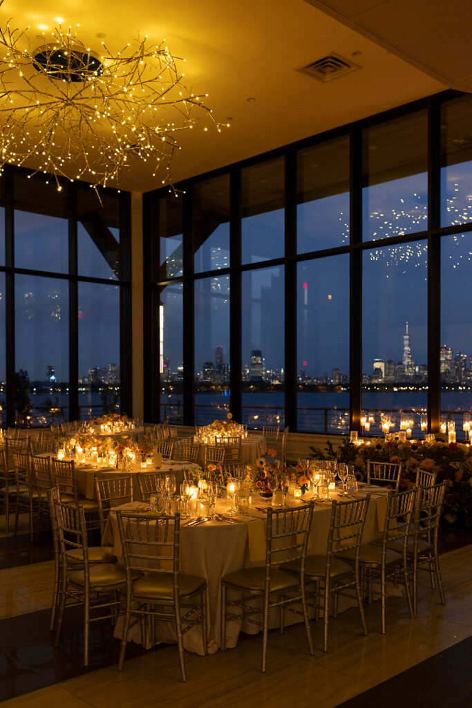 New Jersey wedding reception hall after sunset with NYC skyline outside the windows.