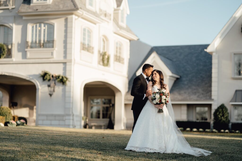 Newlyweds posing in front of the park chateau, a luxury wedding venue in new jersey.
